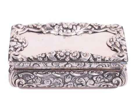 A Victorian silver snuff box by Nathaniel Mills, Birmingham 1846, of rectangular form, with cushioned sides chased with flora