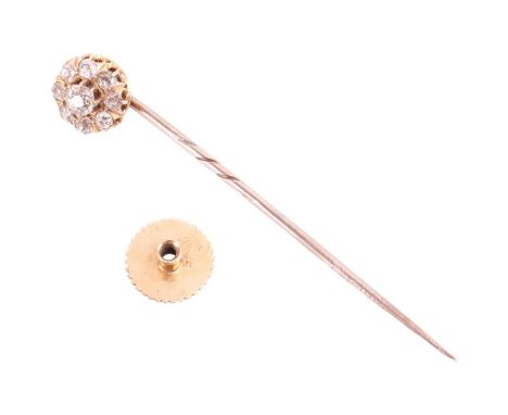 A 19th century diamond cluster stick pin convertible to dress stud, featuring an old cut diamond cluster with a total estimat