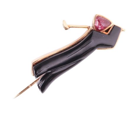 Of golfing interest - an Art Deco style novelty stick pin depicting golfer swinging a club, with a carved onyx body and a cab