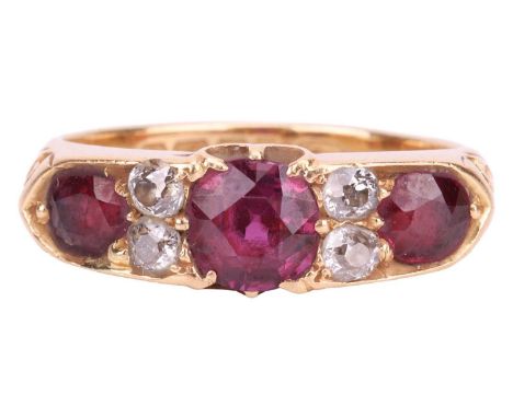 A late Victorian ruby and diamond half-hoop ring in 18ct gold, comprising three graduated circular-shaped rubies, with four o