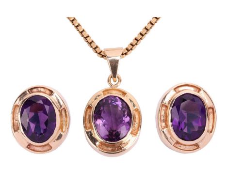 An amethyst earring and pendant necklace suite; each earring set with an oval amethyst measuring 15.5 x 11.5 x 6.8mm, in yell