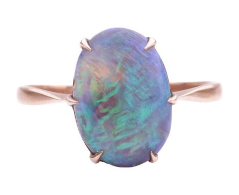 A black opal dress ring, featuring an oval precious opal cabochon approximately measuring 13.4 x 9.3 x 4.7 mm, displaying mil