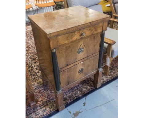 COMMODE, Biedermeier walnut and ebonised with columns flanking three drawers, 57cm x 45cm x 85cm H. (with faults)