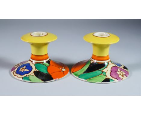 Gardenia, a Pair of Clarice Cliff Bizarre Candlesticks, shape no. 310, painted in colours, 3.25ins high, printed mark with Wi