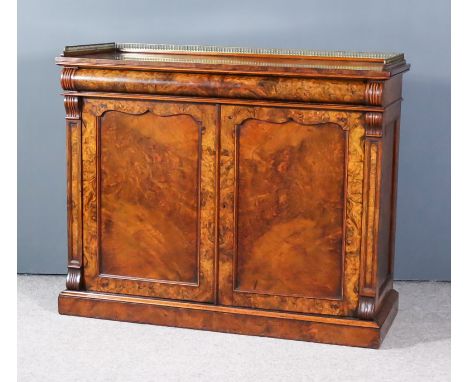 A William IV Figured and Burr Walnut Chiffonier with gilt brass gallery, cushion moulded frieze drawer, cupboard under fitted