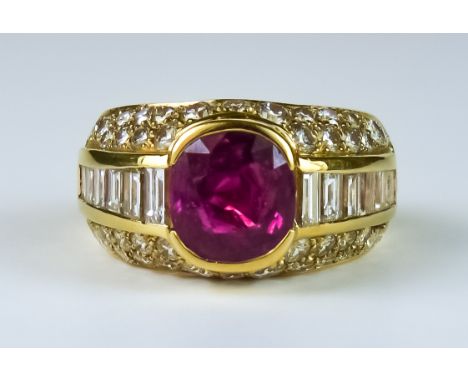 A Ruby and Diamond Ring, Modern, 18ct gold, set with a central faceted ruby, approximately 1ct, flanked by baguette diamonds 