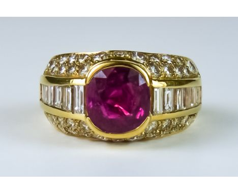 A Ruby and Diamond Ring, Modern, 18ct gold, set with a central faceted ruby, approximately 1ct, flanked by baguette diamonds 