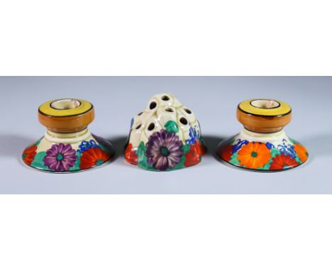 Gayday, a Pair of Clarice Cliff Candlesticks and a Flower Frog, the candlesticks shape no. 331, 2ins high, printed mark with 