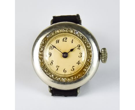 An Early 20th Century Lady's Manual Wind Wristwatch, 24mm diameter case, platinum case with diamond set bezel, white enamel f