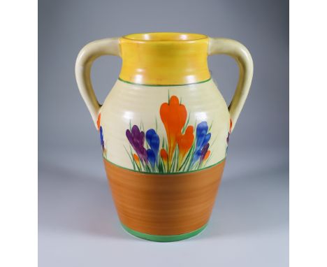 Crocus, a Clarice Cliff Bizarre Twin-Handled Lotus Jug, painted in colours between yellow and brown bands, 12ins high, printe