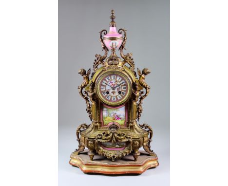 A Late 19th Century French Gilt Metal and Porcelain Mounted Mantel Clock, No. 695, the 3.5ins diameter porcelain dial with Ro