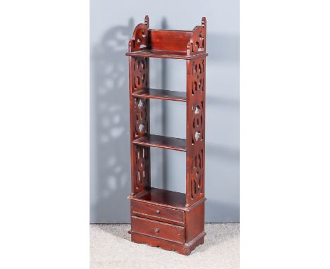 A Mahogany Four-Tier Shelf Unit, with moulded edge to top, each tier with fretted panels to each side, two small drawers unde