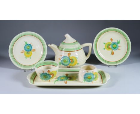 Honeydew, a Clarice Cliff Lyton Part Tea Service, comprising- teapot 6.5ins high, milk jug, sugar basin, six cups, eight sauc