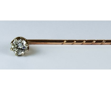 A Diamond Stick Pin, Late19th/ Early 20th Century, yellow coloured metal set with a brilliant cut round diamond,  approximate