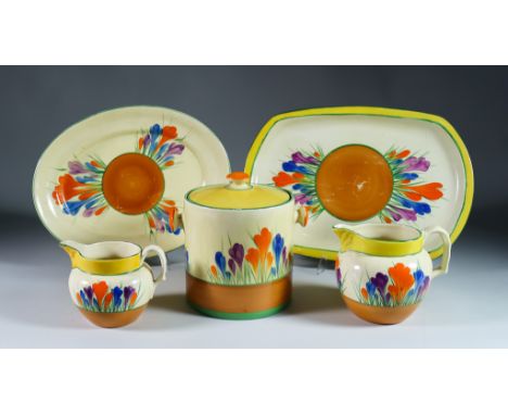Crocus, a selection of Clarice Cliff Bizarre Items, comprising- cylindrical biscuit barrel and cover 6.5ins high, three bulbo