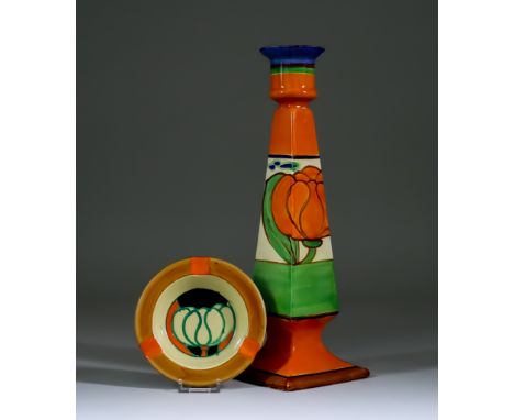 Lily, a Clarice Cliff Fantasque Octagonal Candlestick and Circular Ashtray, the candlestick with orange lily, 11.75ins high, 