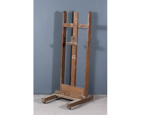 A Victorian Oak Artist's Easel, on trestle feet, 22ins wide x 59ins high