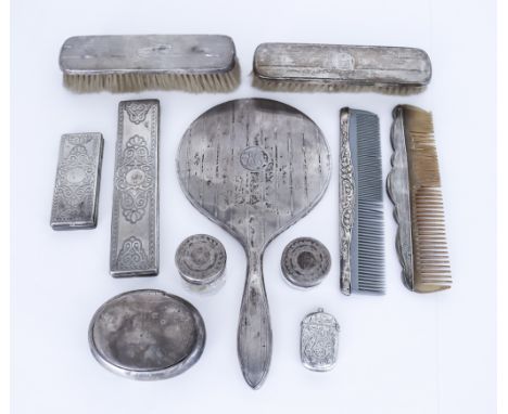 An Edward VII Silver Oval Snuff Box and a Selection of Silver-Backed Dressing Table Items, the snuff box by James Deakin and 