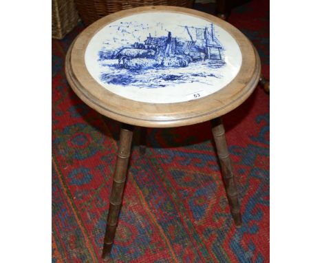 A Minton William Wise circular tile, set in to a tripod table with turned bamboo effect legs, the tile 32cm diameter, the tab