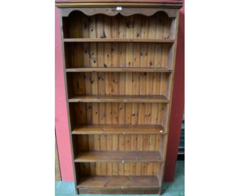 A pine six shelf bookcase