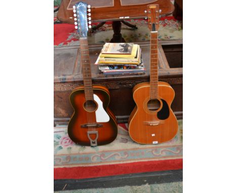 An Eko acoustic twelve string guitar; a Montana acoustic guitar; assorted sheet music books, including The Beatles Complete G