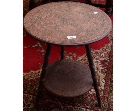 A cricket table, carved top, lower shelf