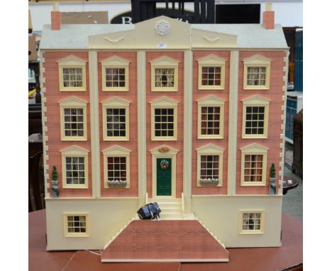 A Dolls House Emporium four storey Victorian town house, The Priory, fitted with lights, dolls, furniture, garden furniture, 