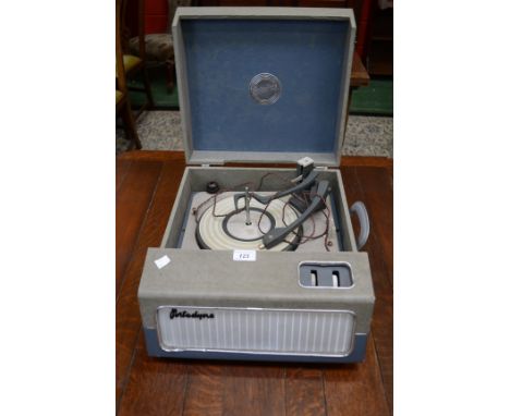A retro Monarch Portadyne portable record player, built in speaker, two tone grey and blue case