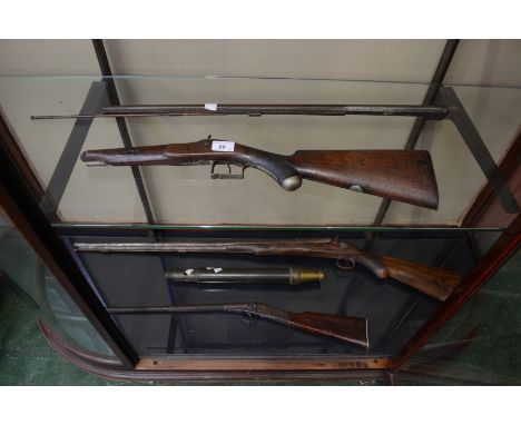 A sporting rifle; a 'spud' gun; a Wills shotgun; a firemans hose nozzle