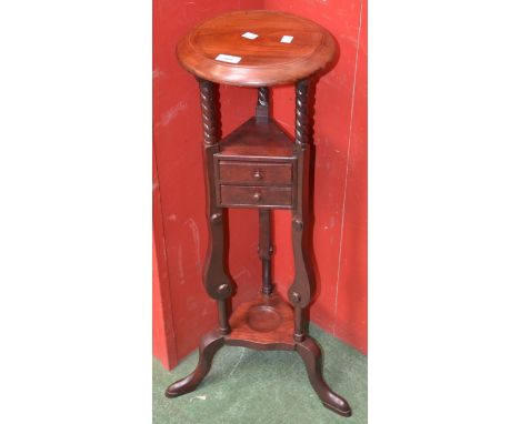 A George III style stained tripod smokers stand, turned barley twist columns, splayed feet