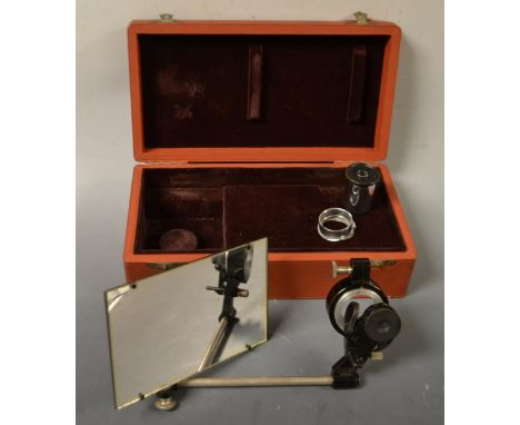 An E Leitz Wetzlar (Leica) camera lucida microscope attachment 13cm rectangular plate, adjustable lenses and clamp, the box i