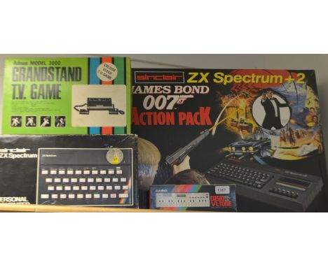 Vintage Computing - a Sinclair ZX Spectrum computer, boxed with games;  a ZX Spectrum + 2 JamesBond Action pack compurter;  a
