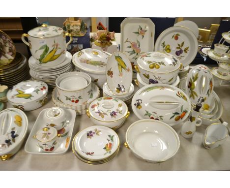 A Royal Worcester Evesham pattern oven to table service inc flan dishes; oven dishes, tureens, Soup tureen, dinner and side p