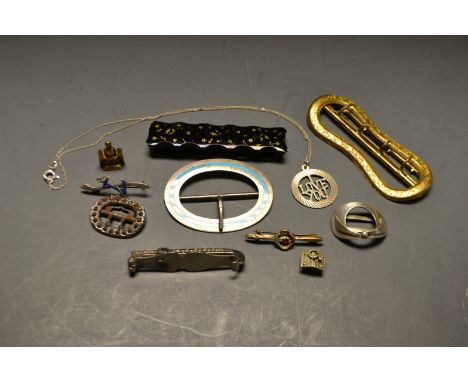 A silver and enamel buckle, Chester 1909; other buckles; pendant; etc.