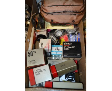 Photography - a Canon AE-1 35mm camera, boxed; another, Canon AE-1 program; associated lenses, 135/3.5, 50/1.8; other accesso