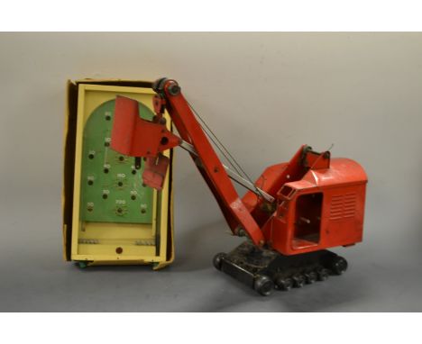 A Tri-Ang earth excavator; a Chad Valley pinball (2)