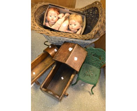 A Victorian woven cane and wrought iron dolls pram, white painted oval body, bent strap suspension, eight spoke metal wheels,