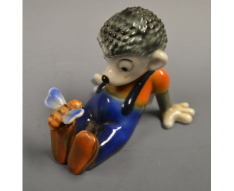 A Goebel model Mecki seated with insect alighting from his feet, faint impressed no, printed marks dated 1956