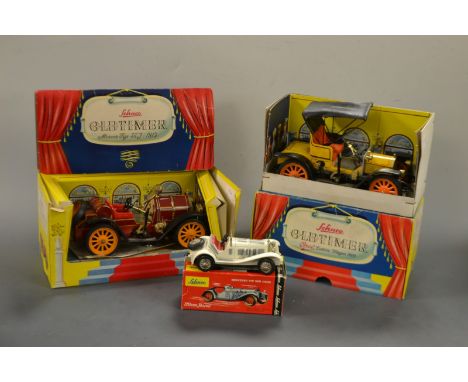 Model Cars - a Schuco Old Timer tin plate clockwork car in yellow,1228, boxed; another Old Timer in red, 1225, boxed; a Schuc