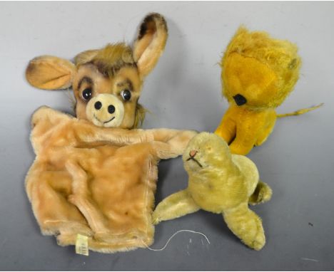 A small mohair seal; a mohair novelty lion; a donkey hand puppet (3)