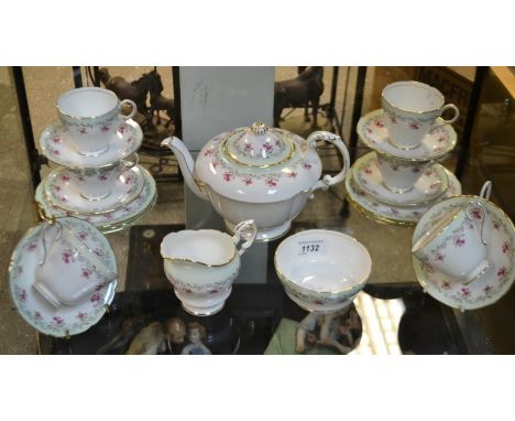 A Paragon six-setting floral tea service, comprising teapot, milk jug and sugar bowl, cups, saucers and side plates 