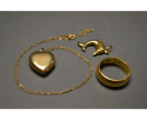 **PLEASE NOTE THIS LOVE HEART PENDANT IS PLATED**A 9ct gold plated love heart pendant, a 9ct gold chain; a dolphin pendant; a