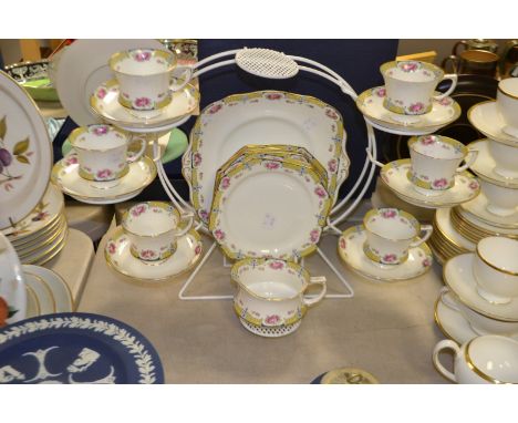 A Paragon six setting tea service decorated with pink and red roses, pattern no Y1963