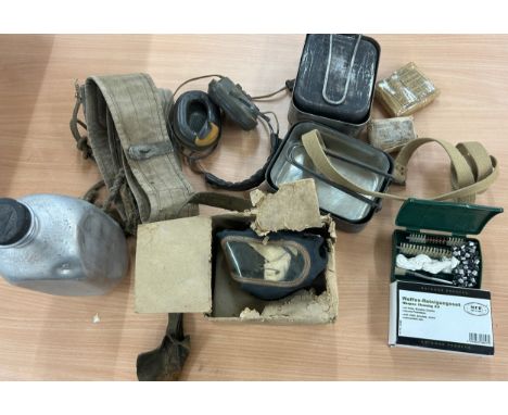 Selection of army supplies to include water bottle, gas mask, ammunition belt, field dressing kit etc 