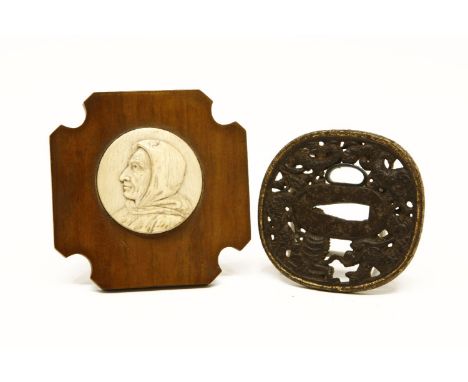 A miniature finely carved bone plaque,with portrait in profile depicting 15th Century monk, Savonarola, mounted in a shaped h