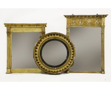 Two George III gilt framed mirrors, together with an early 20th Century Egyptian revival mirror, 71cm and 84cm high