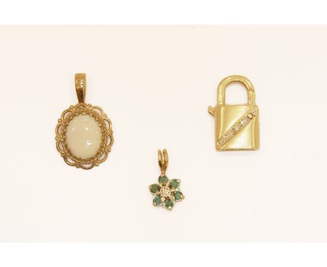 An 18ct gold diamond set padlock charm/clasp, a gold diamond and emerald cluster pendant, (tested as 9ct gold), a gold oval c