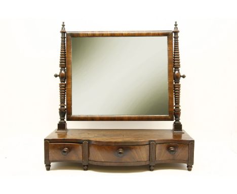 A 19th century mahogany bow front toilet swing mirror,on three drawer stand,62 cm high