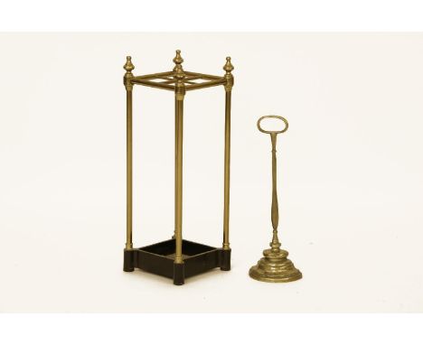 A brass and iron stick stand, and a brass door stop (2)