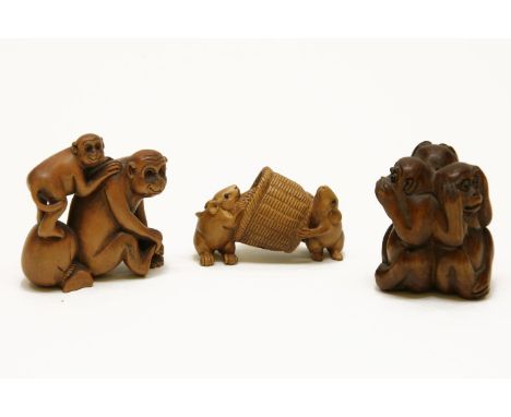 Two Japanese carved wood netsuke, two mice on a basket and two monkeys, and a carved wood figure of three monkeys, signed (3)